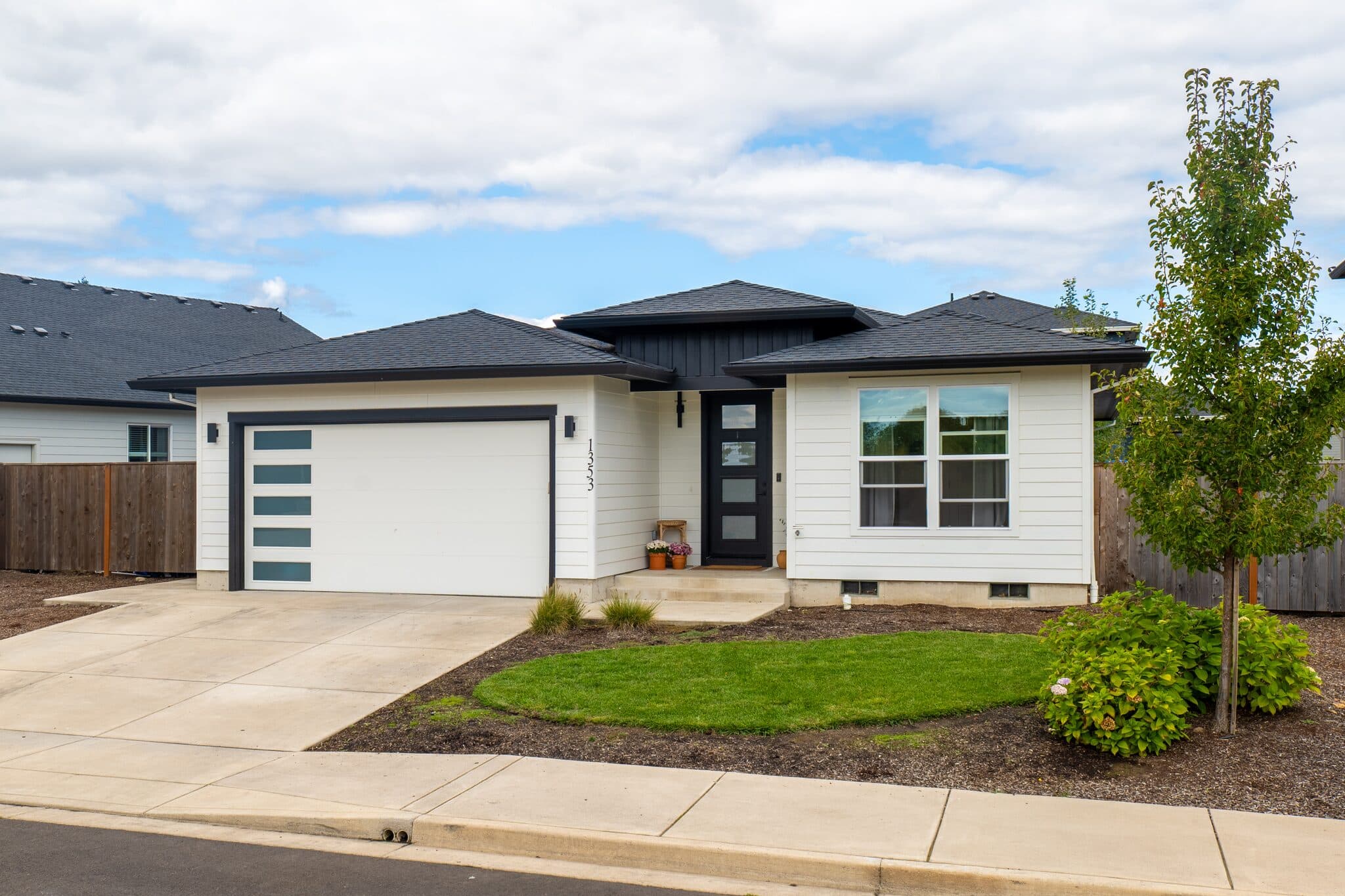Modern single-story home exterior with landscaped yard — real estate photography by Hahn Media, Oregon